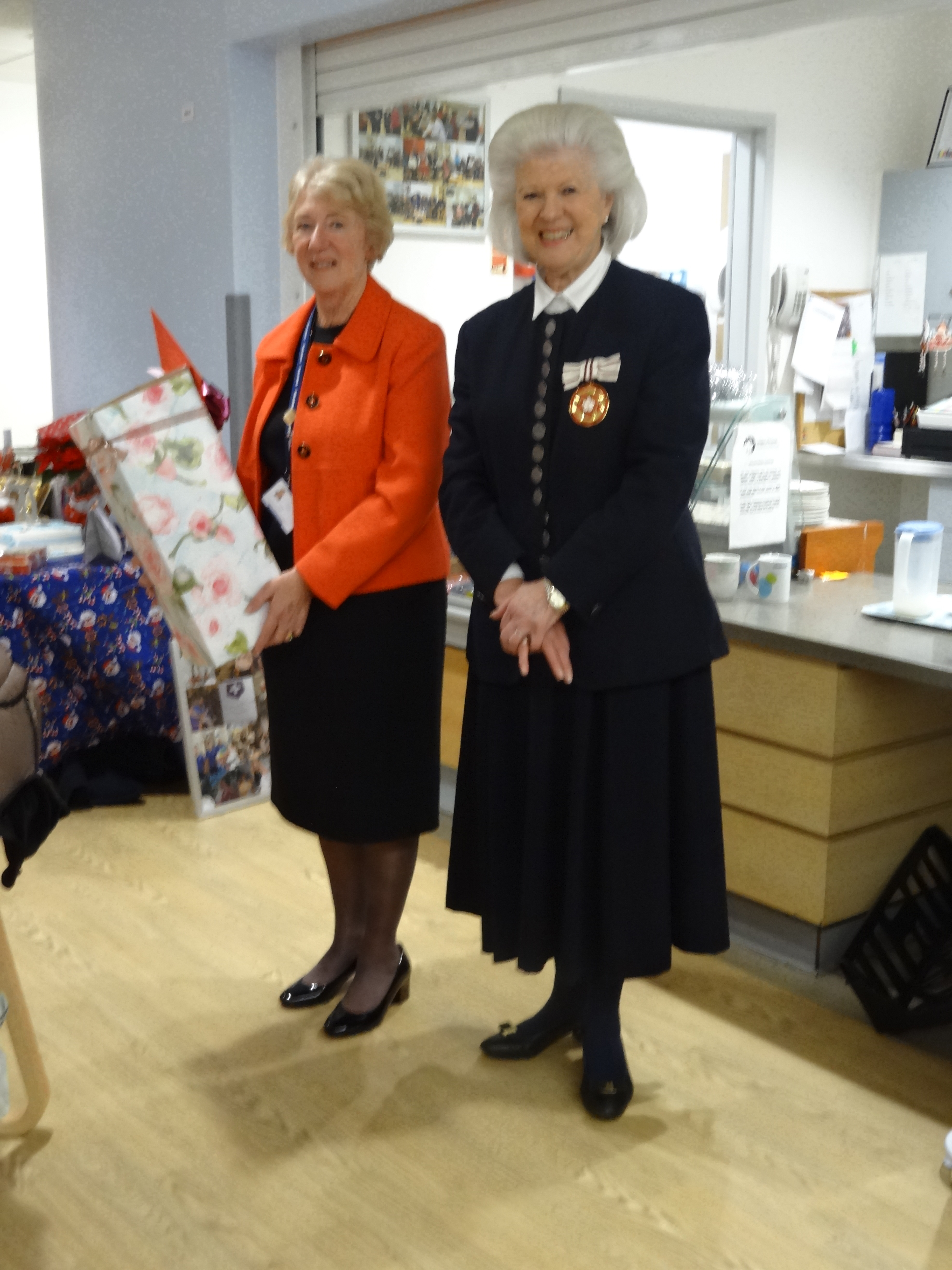 Alison Earle receives her farewell rose from Deputy  Lieutenant of Hampshire, Mrs Patricia McCowan DL.